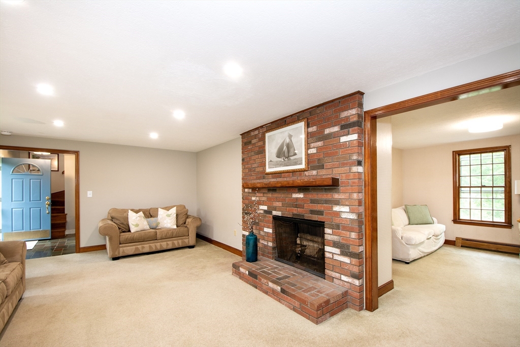 26 Old Coach Road Cohasset, MA 02025 - Photo 14 of 33 a living room with furniture and a fireplace