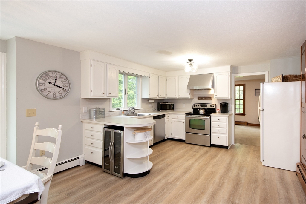 26 Old Coach Road Cohasset, MA 02025 - Photo 2 of 33 a kitchen with a refrigerator cabinets and wooden floor