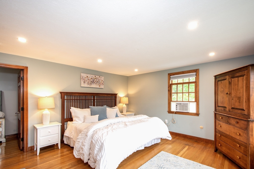 26 Old Coach Road Cohasset, MA 02025 - Photo 25 of 33 a bedroom with bed and wooden floor