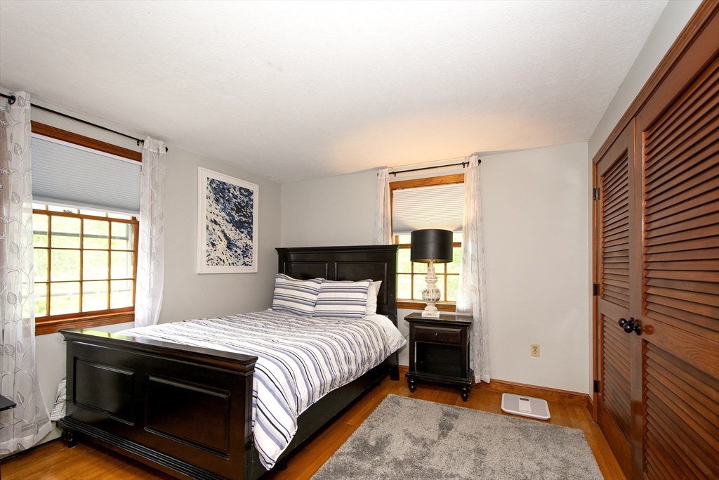 26 Old Coach Road Cohasset, MA 02025 - Photo 28 of 33 a bedroom with a bed and a window