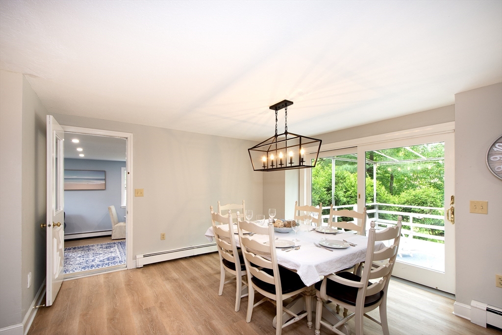 26 Old Coach Road Cohasset, MA 02025 - Photo 4 of 33 a view of a dining room with furniture window and outside view