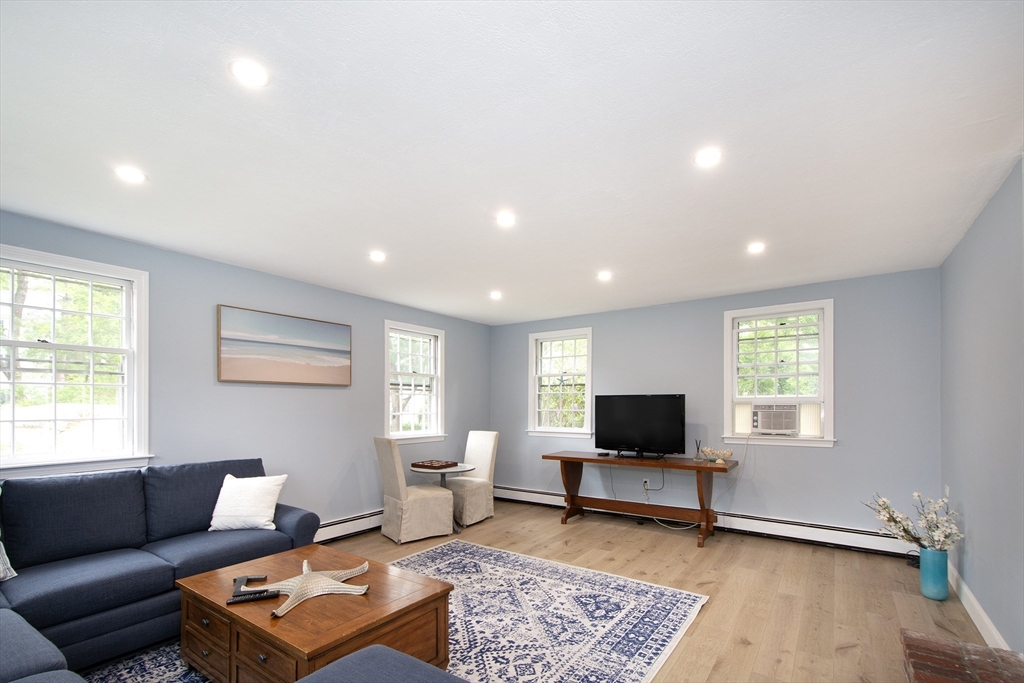 26 Old Coach Road Cohasset, MA 02025 - Photo 9 of 33 a living room with furniture and a window