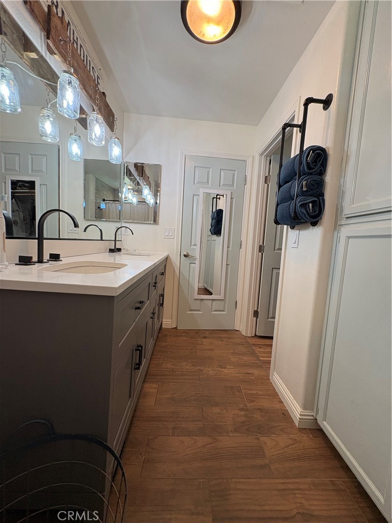 8199 Plane View Place Paso Robles, CA 93446 - Photo 11 of 22 a spacious bathroom with a double vanity sink and a mirror