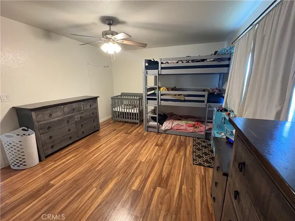 a bed room with a bed and a dresser