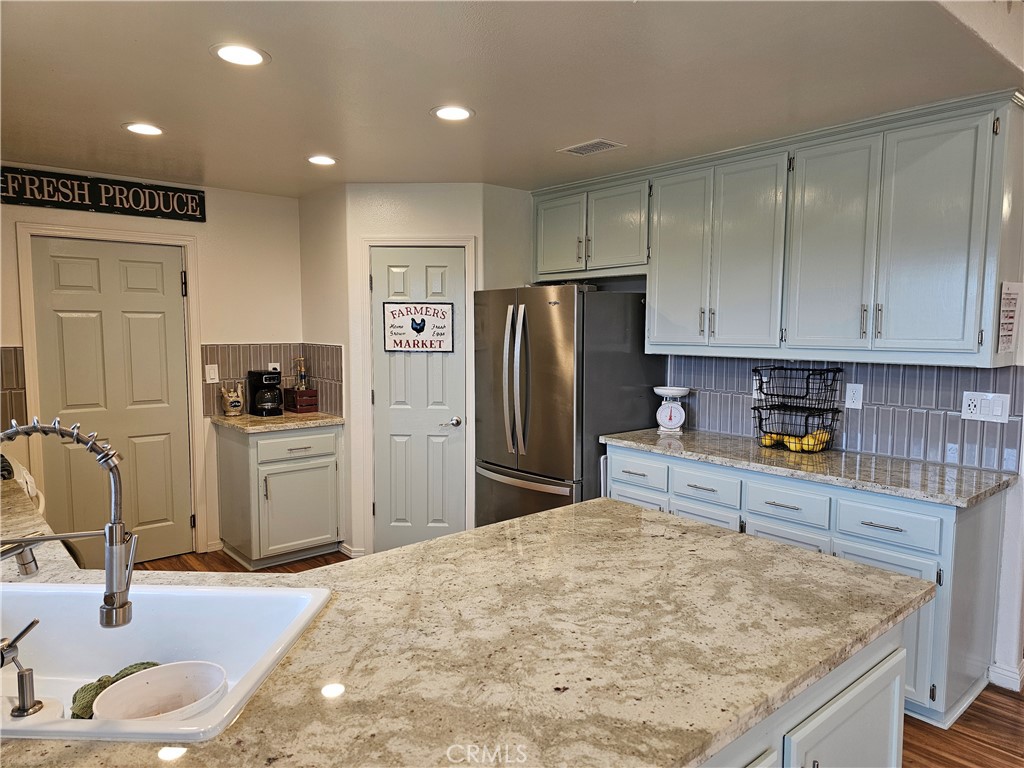 8199 Plane View Place Paso Robles, CA 93446 - Photo 3 of 22 a kitchen with refrigerator and cabinets