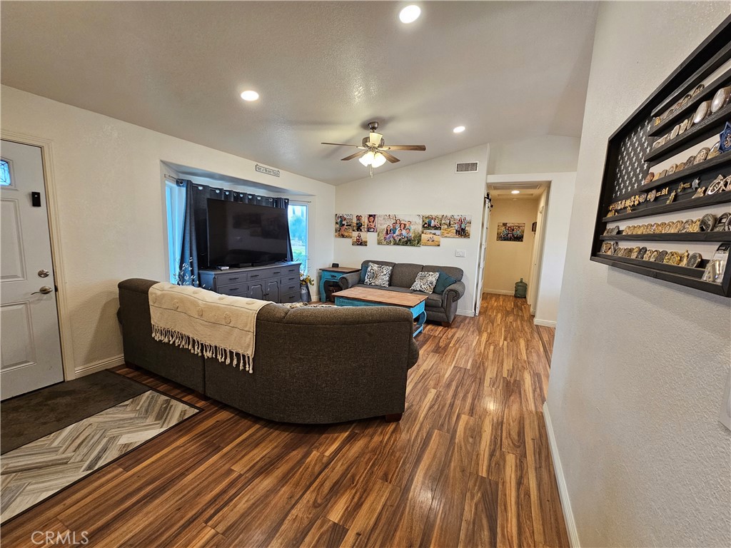 8199 Plane View Place Paso Robles, CA 93446 - Photo 7 of 22 a living room with furniture and a flat screen tv