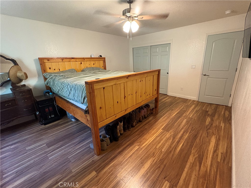 8199 Plane View Place Paso Robles, CA 93446 - Photo 9 of 22 a bedroom with bed and wooden floor