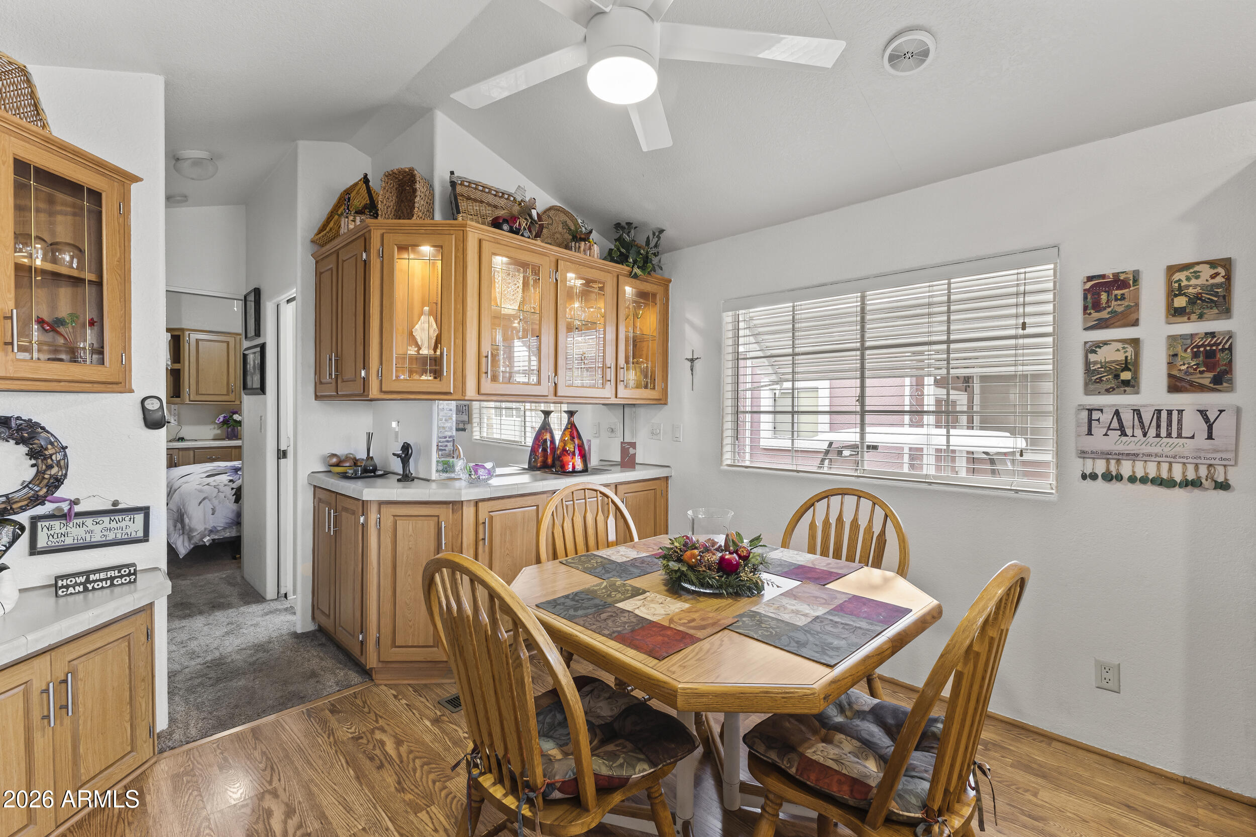 17200 West Bell Road, Unit 548 Surprise, AZ 85374 - Photo 8 of 19 a view of a dining room with furniture and a large window