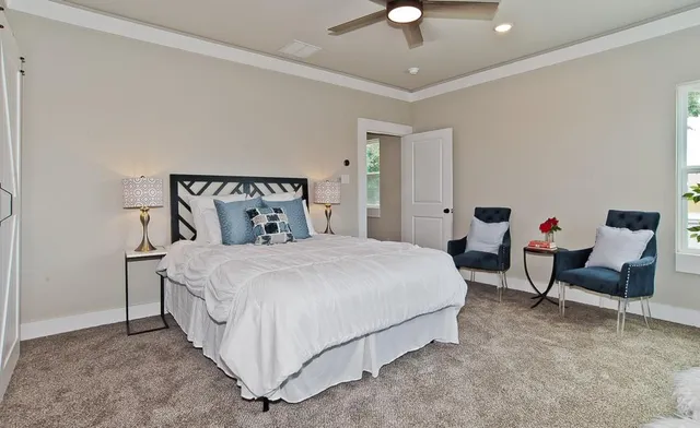 a bedroom with bed and a couch