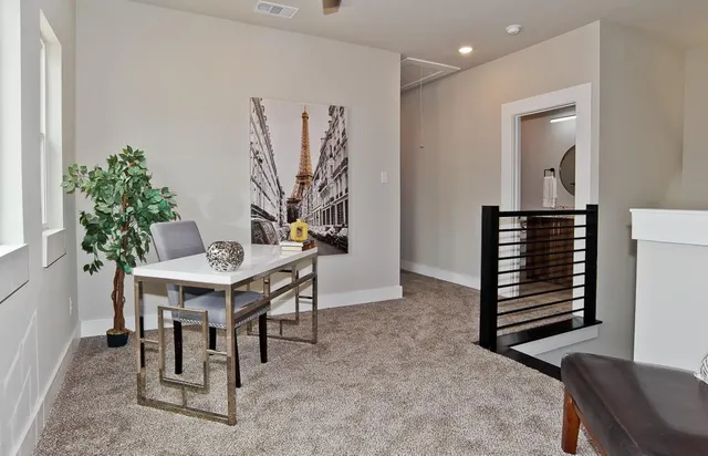 a view of a livingroom with furniture