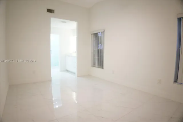 a bathroom with a bathtub and a sink