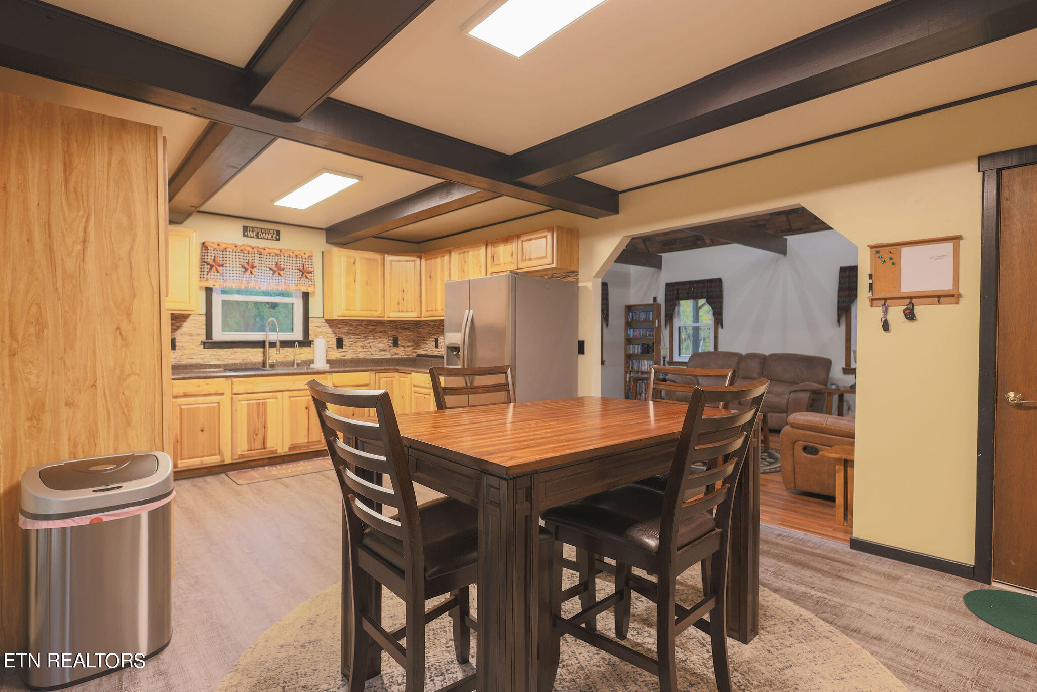 160 Rainbow Lane La Follette, TN 37766 - Photo 12 of 58 a dining room with stainless steel appliances a table and chairs