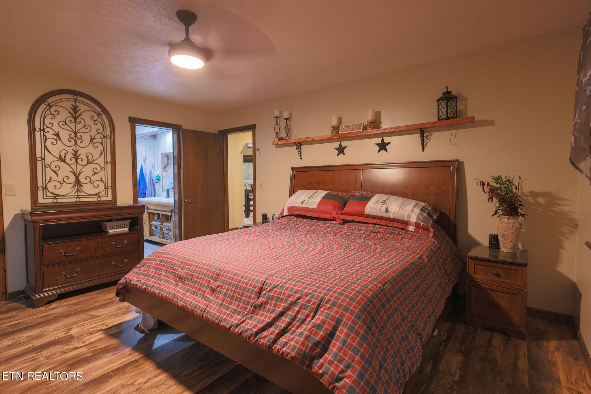 160 Rainbow Lane La Follette, TN 37766 - Photo 21 of 58 a bedroom with a bed and wooden floor