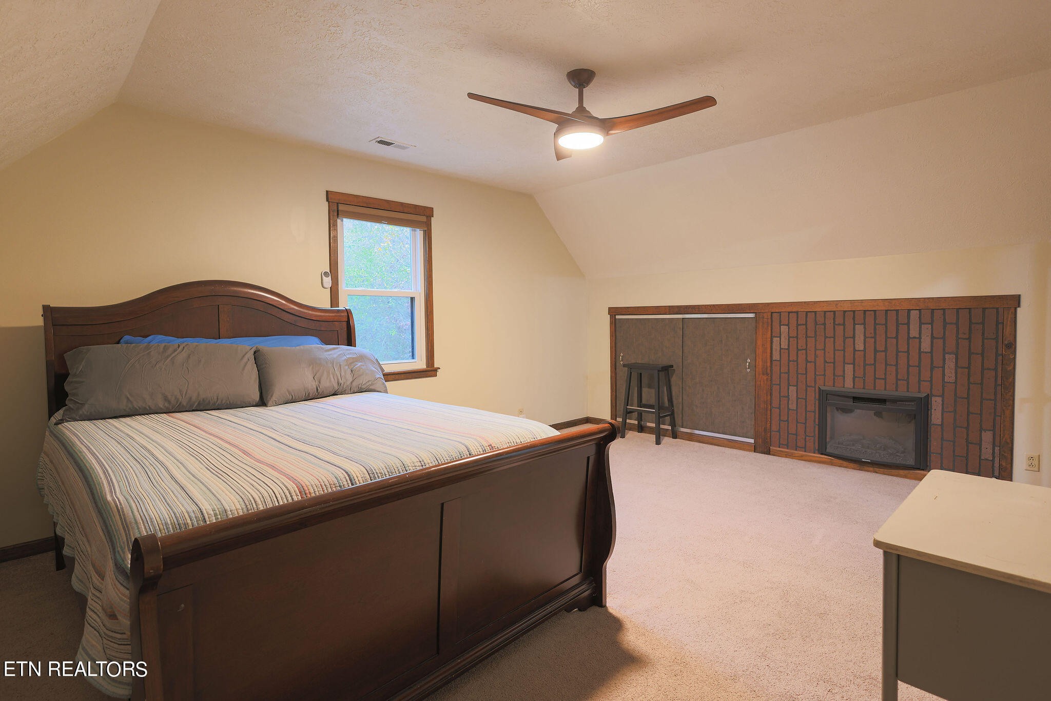 160 Rainbow Lane La Follette, TN 37766 - Photo 37 of 58 a bedroom with a bed and a chandelier