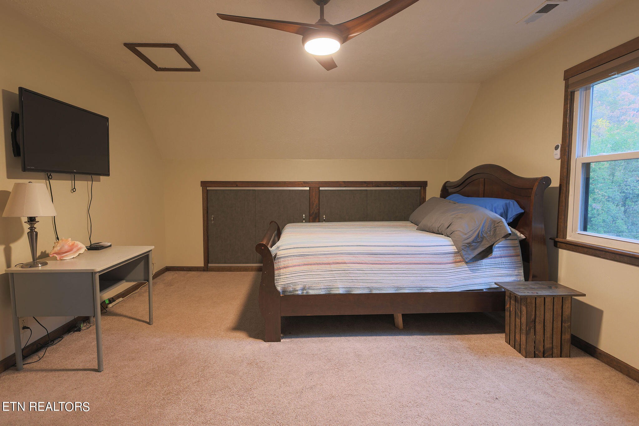 160 Rainbow Lane La Follette, TN 37766 - Photo 39 of 58 a bedroom with a bed and a flat screen tv