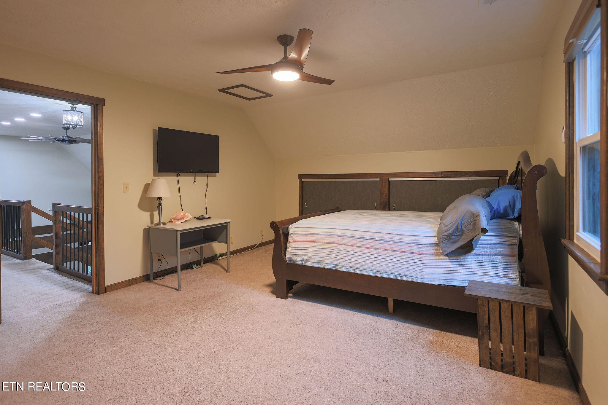 160 Rainbow Lane La Follette, TN 37766 - Photo 40 of 58 a bedroom with a bed and a chandelier