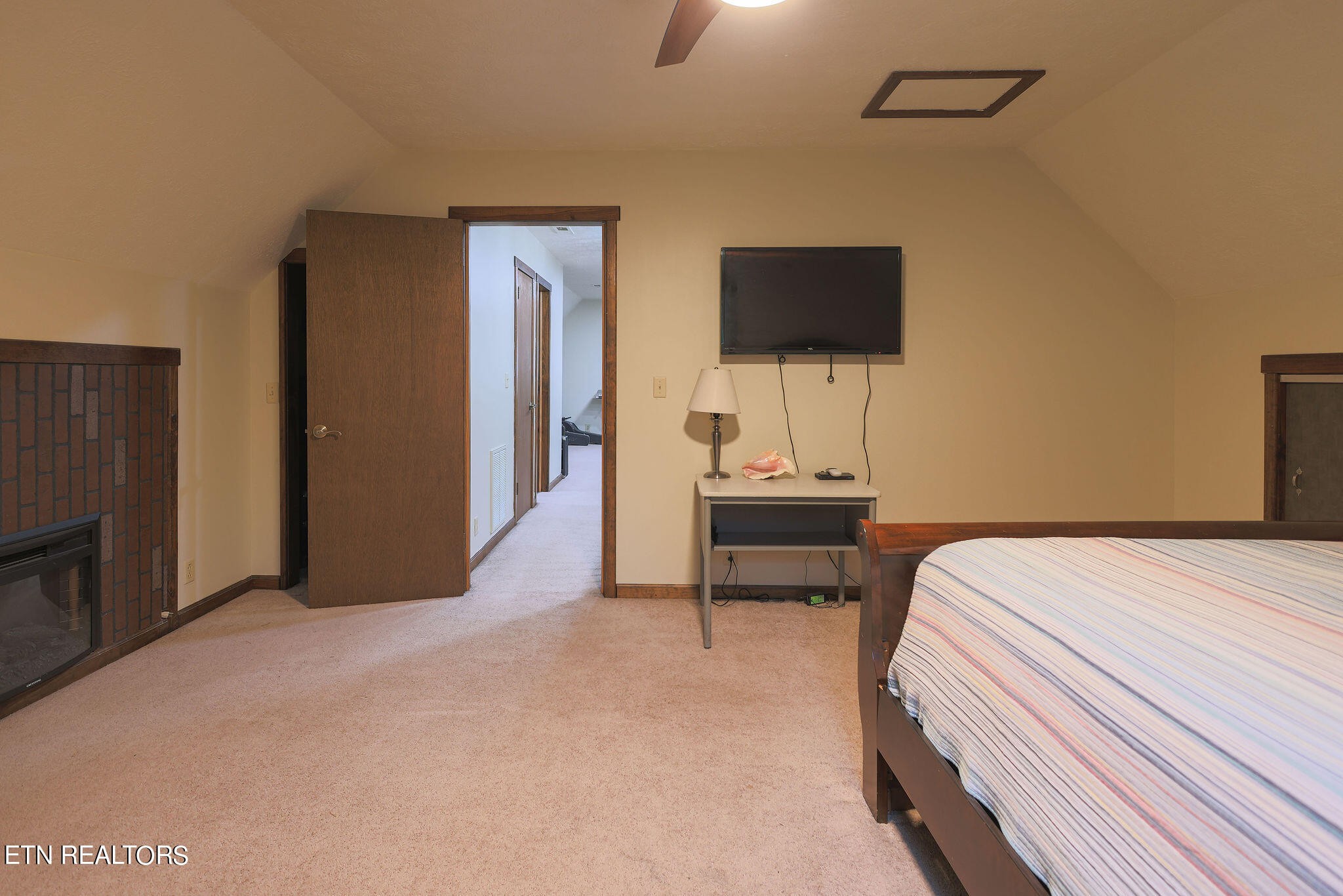 160 Rainbow Lane La Follette, TN 37766 - Photo 41 of 58 a bedroom with a bed and a flat screen tv