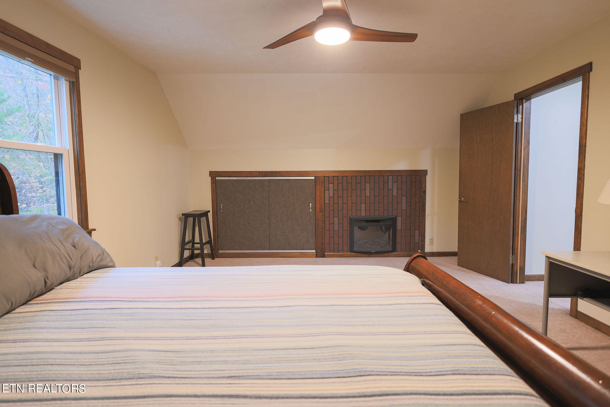 160 Rainbow Lane La Follette, TN 37766 - Photo 42 of 58 a bedroom with a large bed and a large window