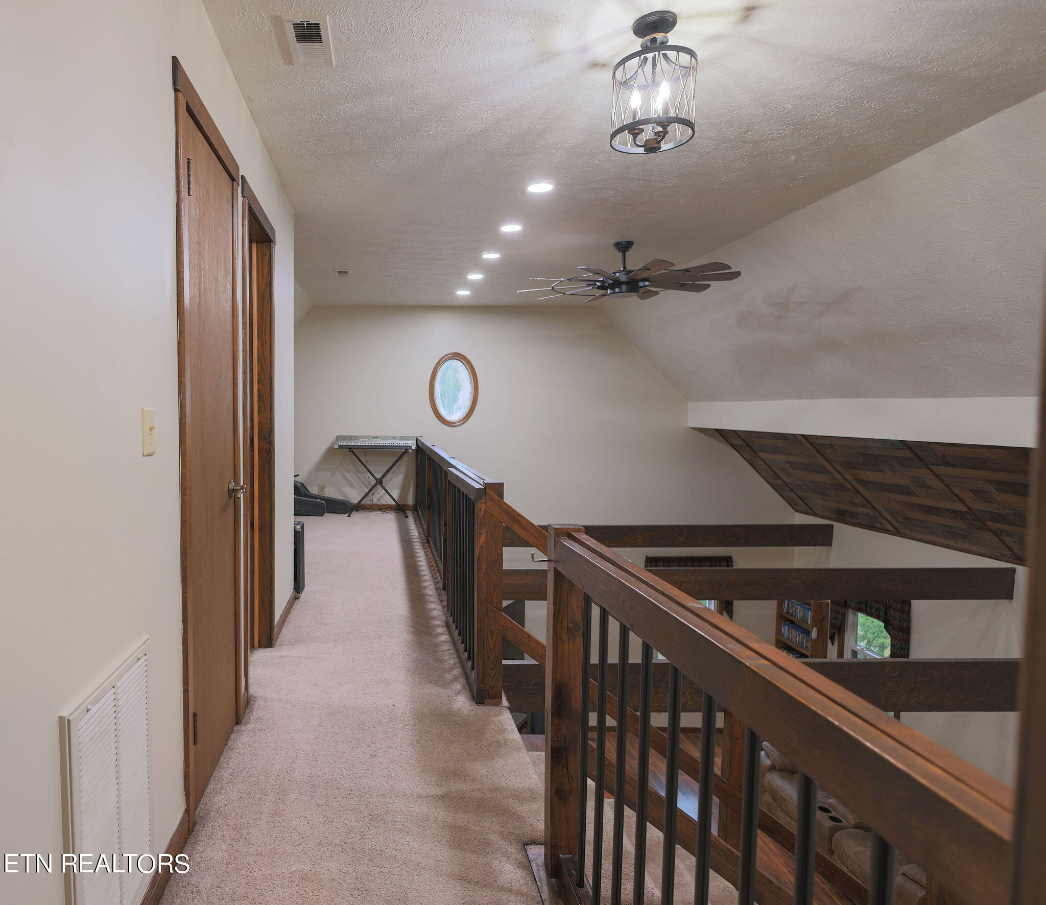 160 Rainbow Lane La Follette, TN 37766 - Photo 43 of 58 a view of a hallway with wooden floor and staircase