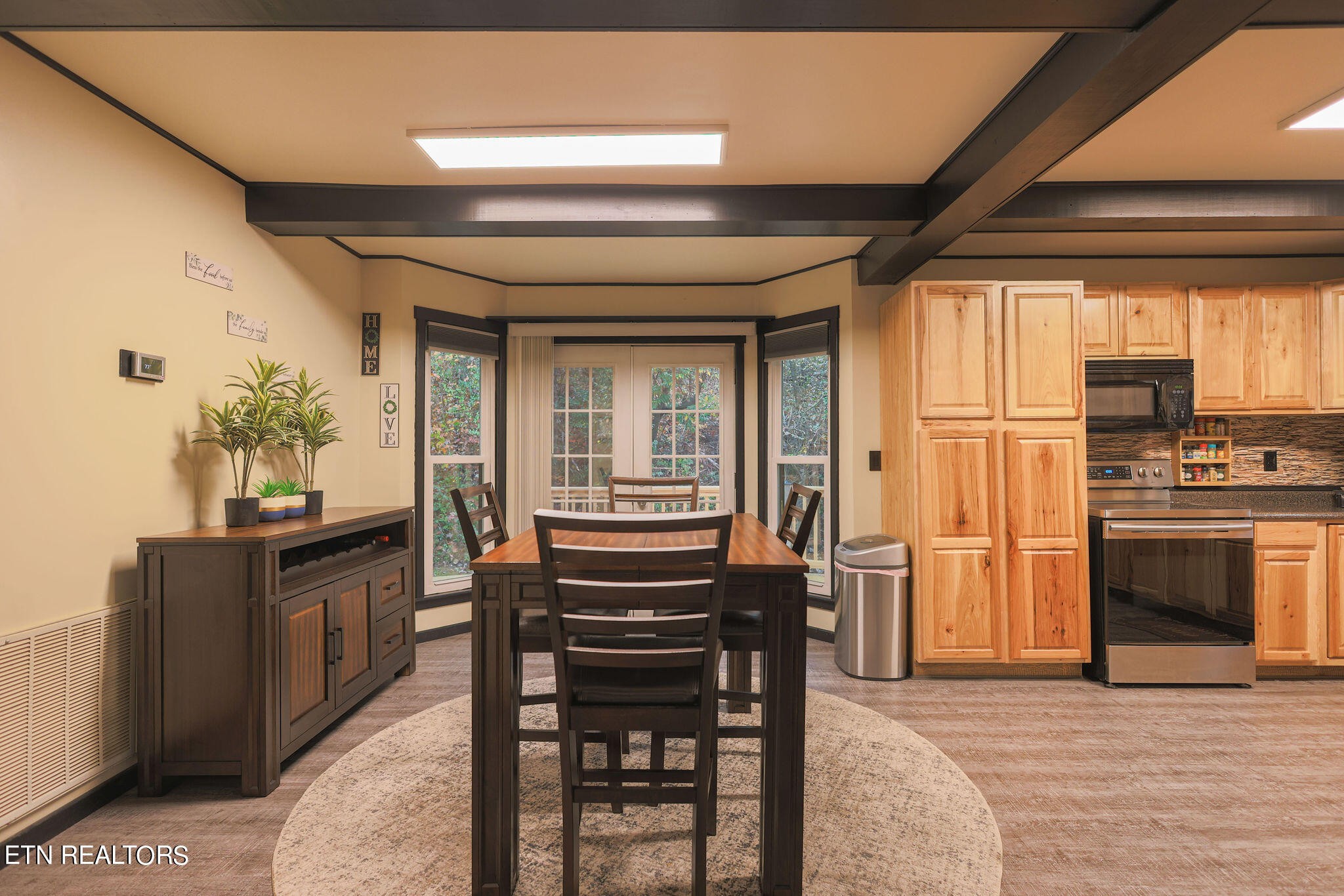 160 Rainbow Lane La Follette, TN 37766 - Photo 10 of 58 a kitchen with granite countertop a stove cabinets and dining table
