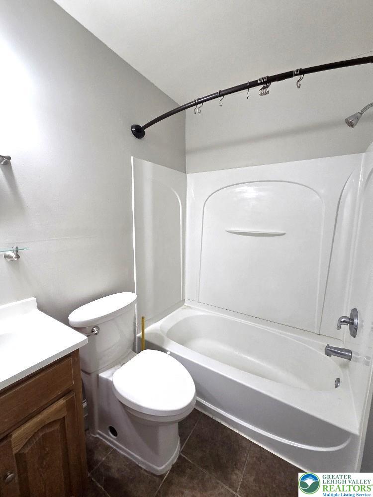 1747 Schoenersville Road Bethlehem, PA 18018 - Photo 9 of 13 Functional full bathroom featuring a tub and shower combination with a vanity sink.