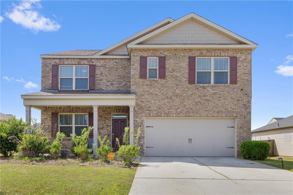1700 Wood Stork Drive Hampton, GA 30228 - Photo 1 of 1 a front view of a house with garden