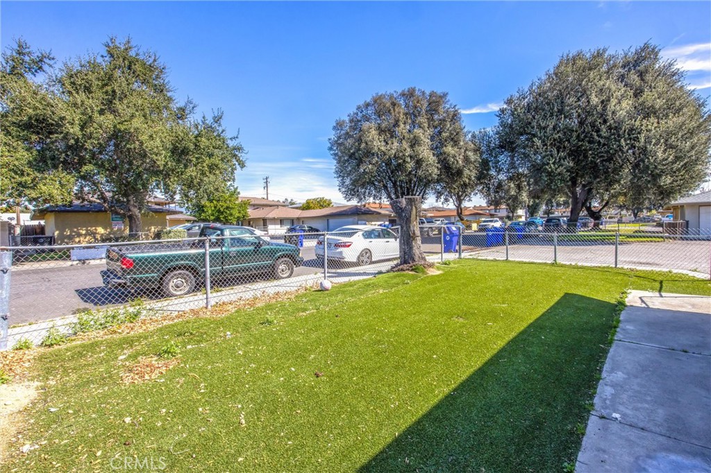 16929 Reed Street Fontana, CA 92336 - Photo 13 of 13 a view of a park with bench and trees