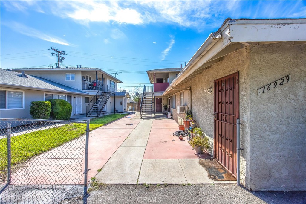 16929 Reed Street Fontana, CA 92336 - Photo 3 of 13 a front view of a house with a yard