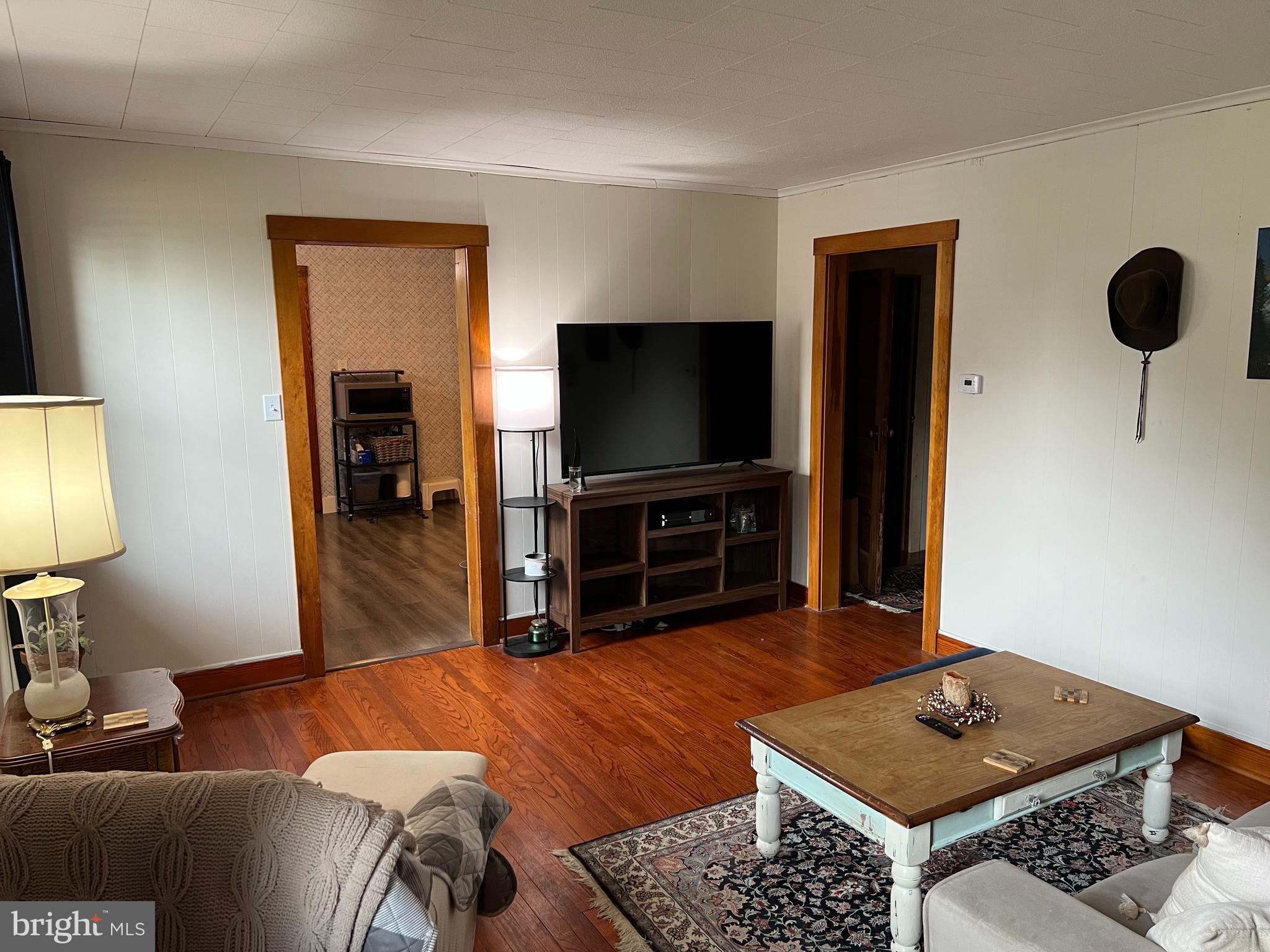 32 Paradise Road Aberdeen, MD 21001 - Photo 13 of 27 a living room with furniture and a flat screen tv