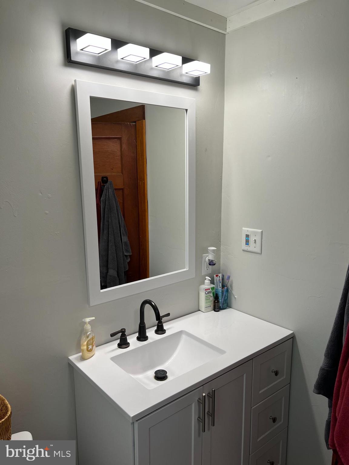 32 Paradise Road Aberdeen, MD 21001 - Photo 19 of 27 a bathroom with a sink and a mirror