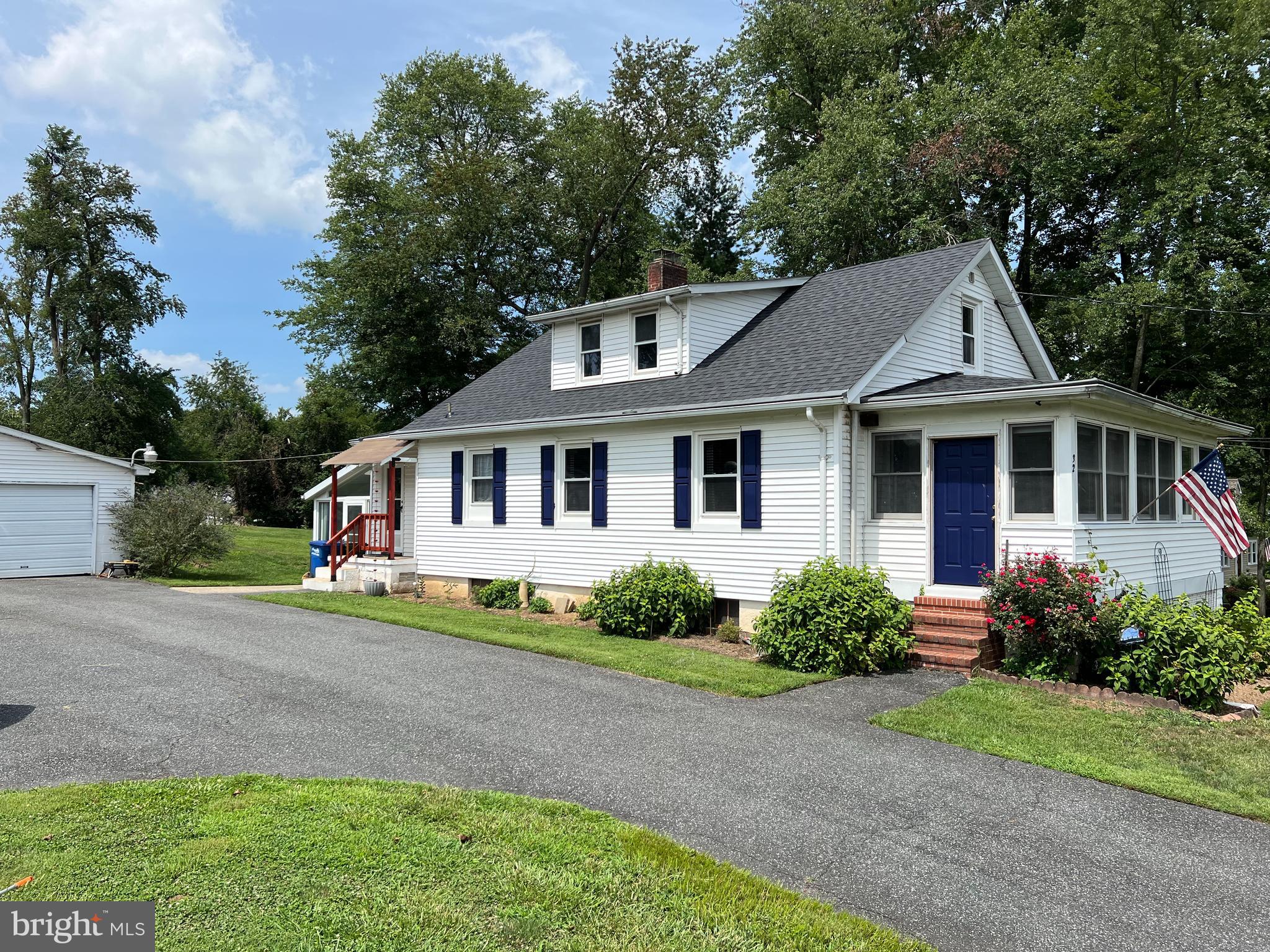 32 Paradise Road Aberdeen, MD 21001 - Photo 2 of 27 a front view of a house with a garden and trees