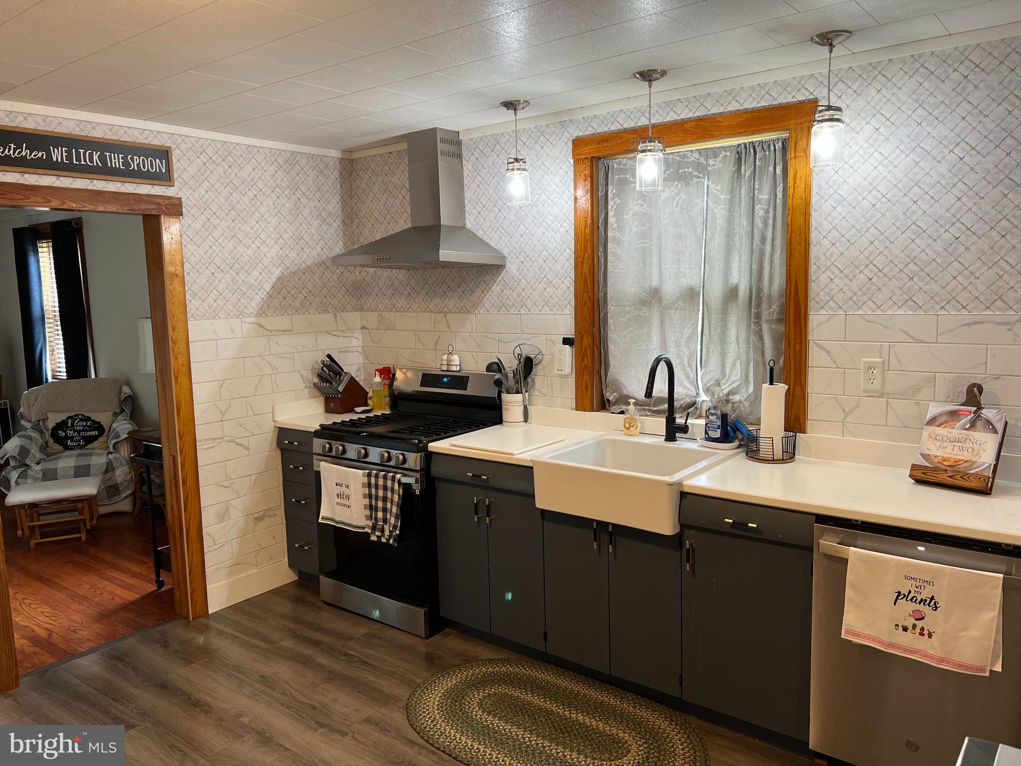 32 Paradise Road Aberdeen, MD 21001 - Photo 5 of 27 a kitchen with a sink cabinets and a wooden floor