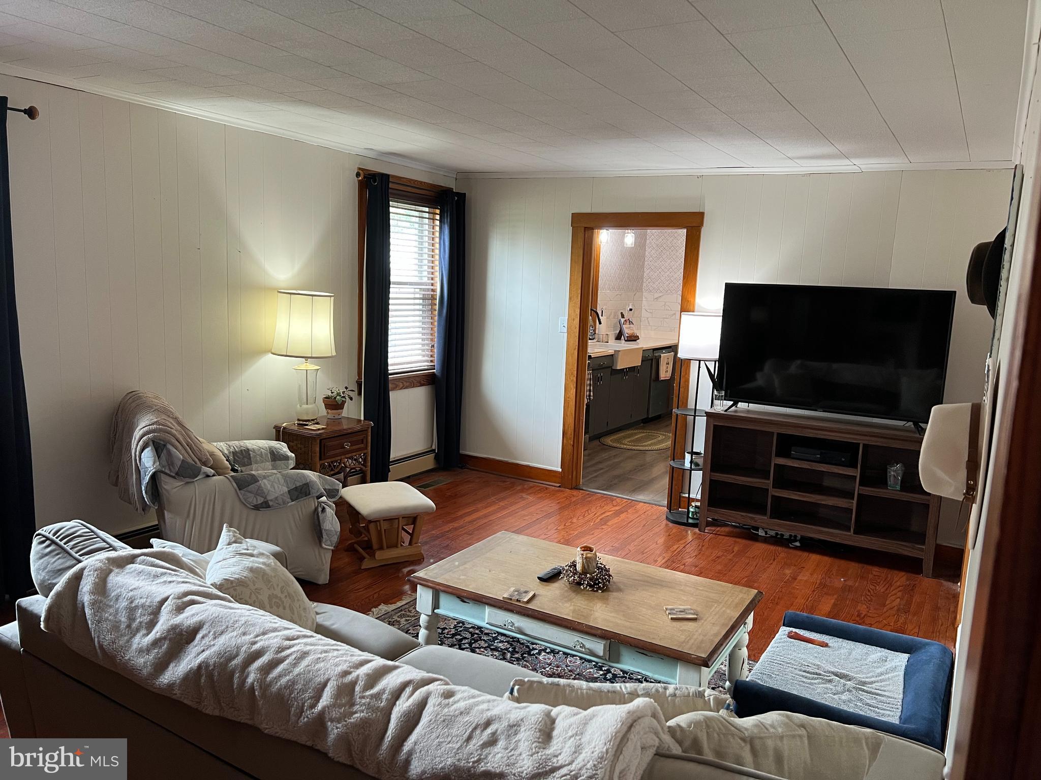 32 Paradise Road Aberdeen, MD 21001 - Photo 10 of 27 a living room with furniture and a flat screen tv