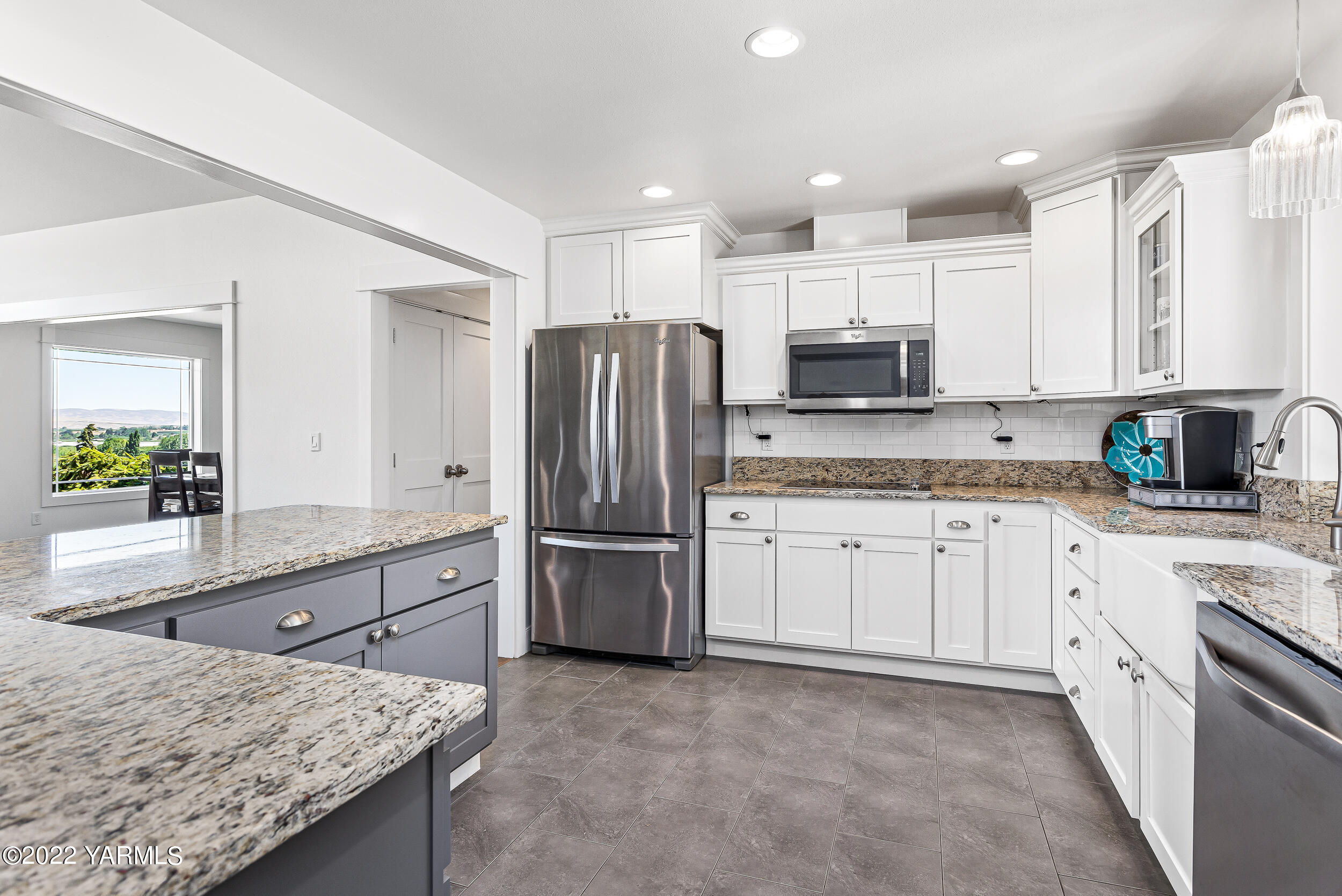 190 Nash Road Tieton, WA 98947 - Photo 13 of 38 a kitchen with stainless steel appliances granite countertop a refrigerator stove microwave and sink