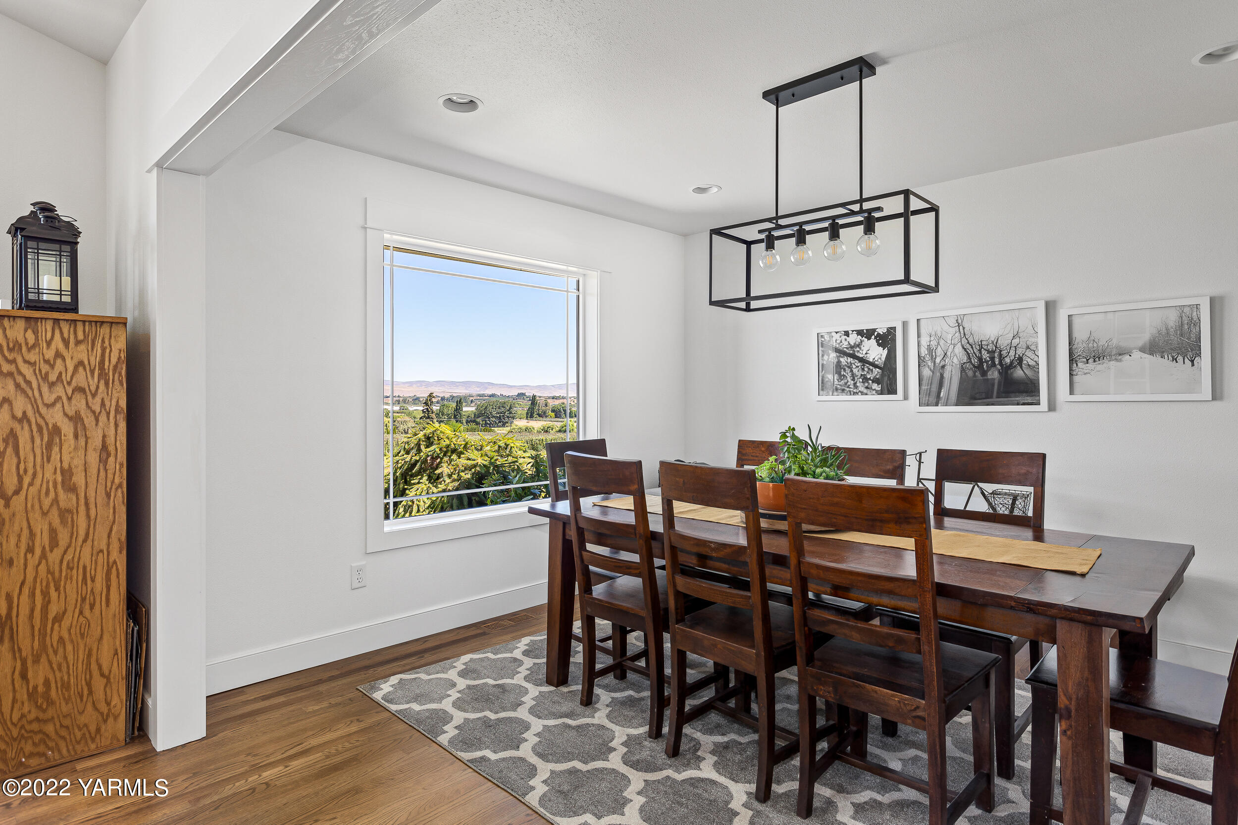 190 Nash Road Tieton, WA 98947 - Photo 20 of 38 a view of a dining room with furniture window and wooden floor