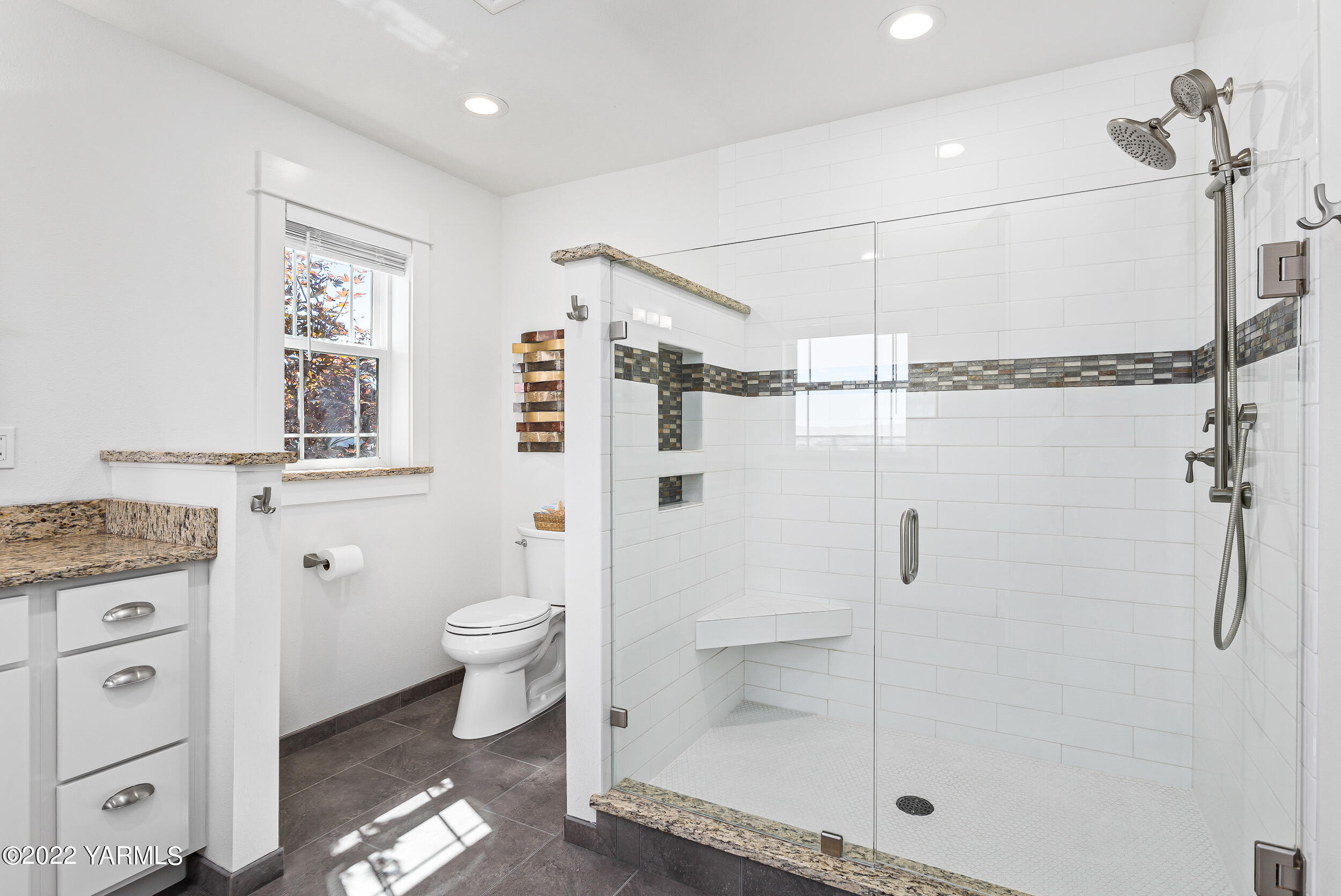 190 Nash Road Tieton, WA 98947 - Photo 26 of 38 a bathroom with a granite countertop shower a toilet and a sink