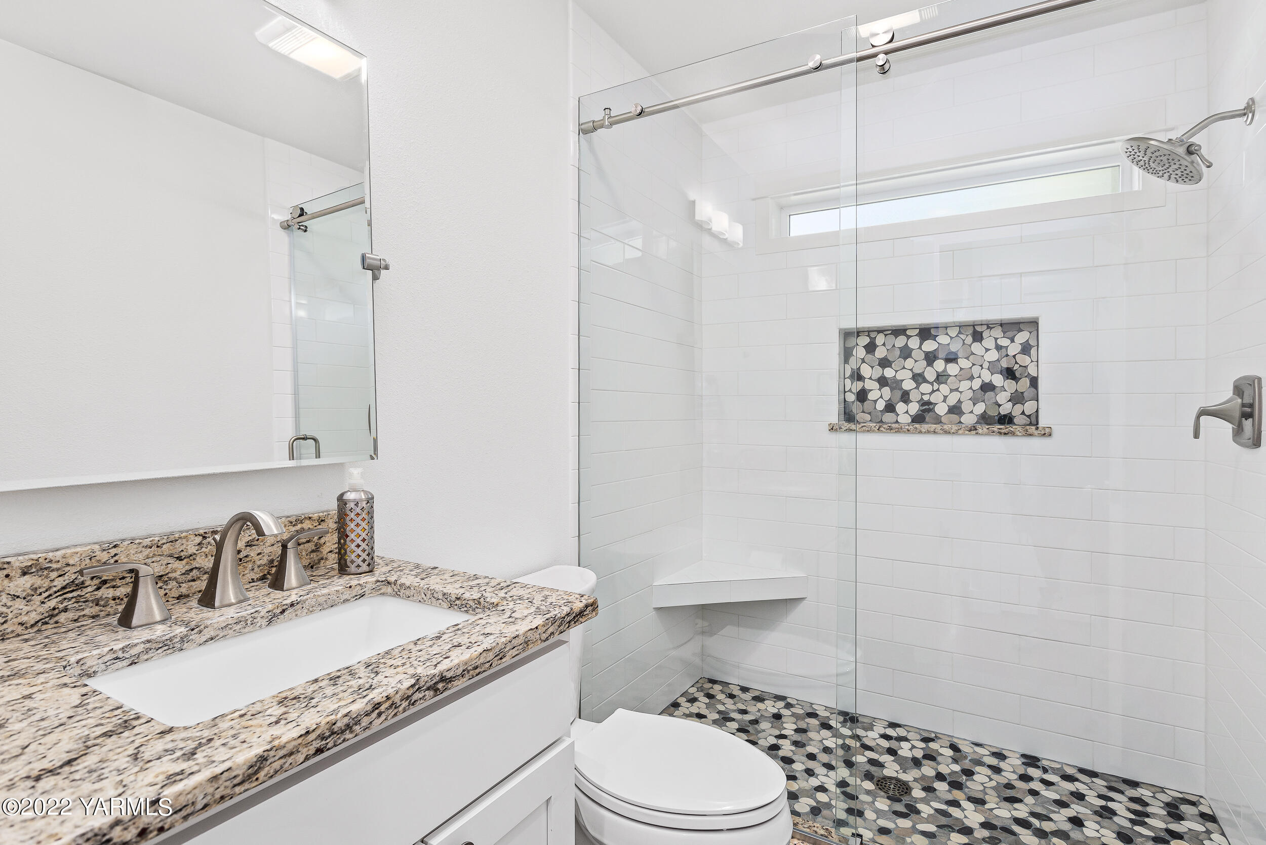 190 Nash Road Tieton, WA 98947 - Photo 32 of 38 a bathroom with a granite countertop sink toilet a mirror and shower