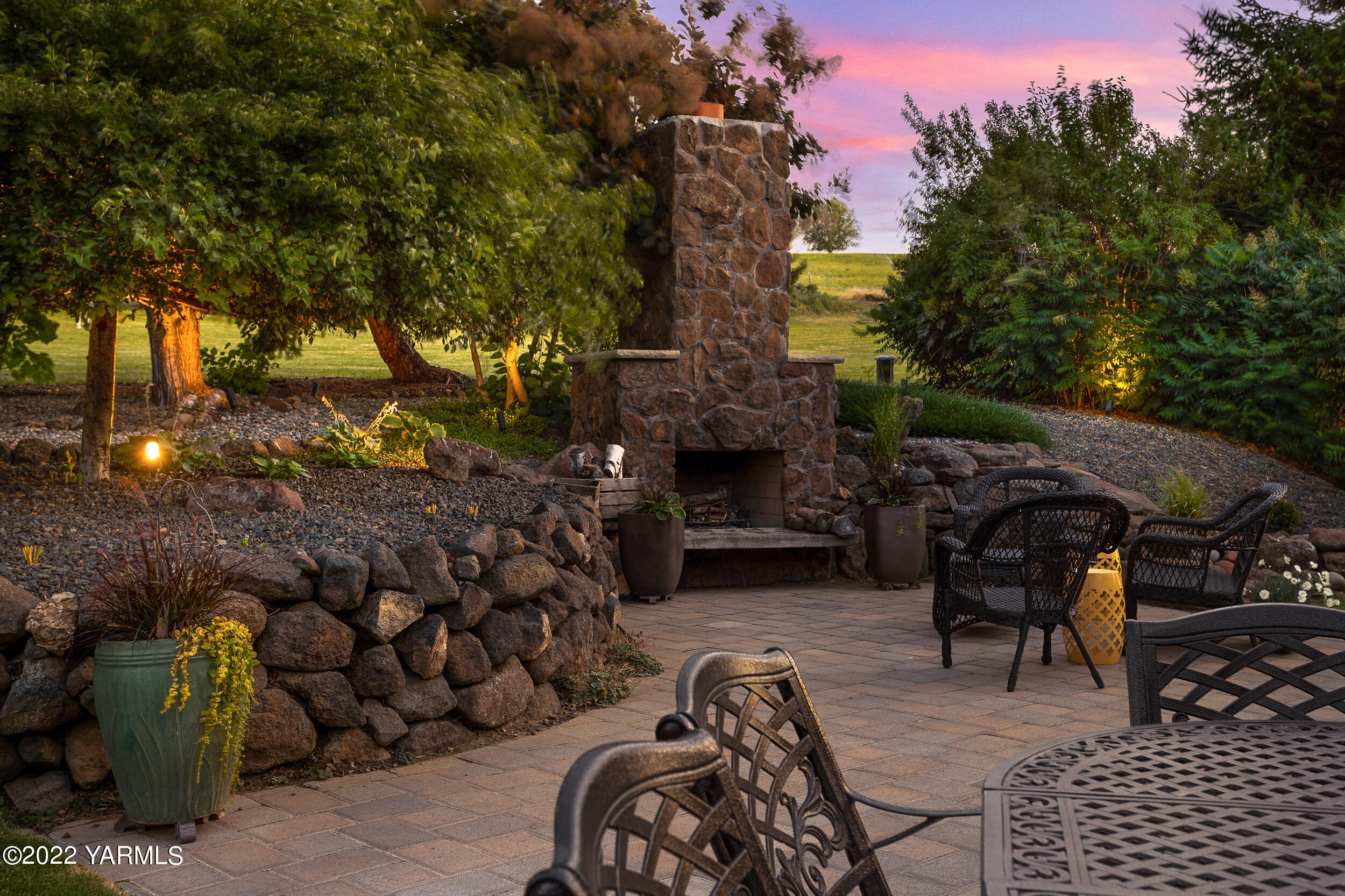 190 Nash Road Tieton, WA 98947 - Photo 9 of 38 a view of a patio with table and chairs and potted plants