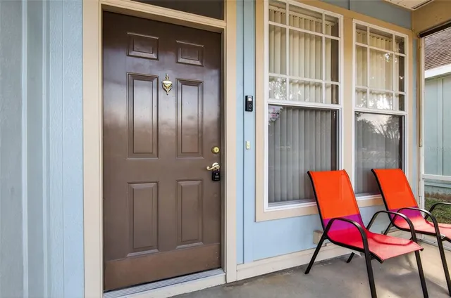 a bench that is sitting in front of a door