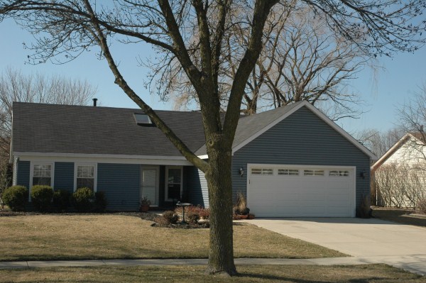 a view of a house with a tree