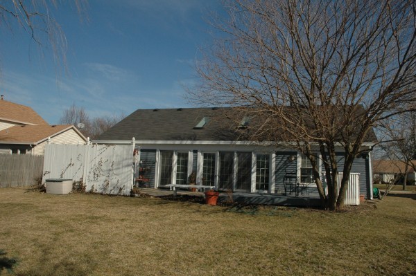 2138 Stirrup Lane Wheaton, IL 60189 - Photo 16 of 16 a view of a house with a yard