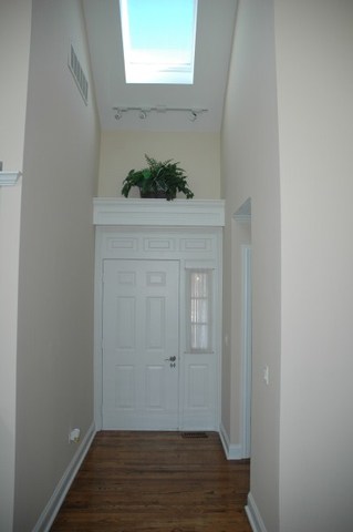 2138 Stirrup Lane Wheaton, IL 60189 - Photo 2 of 16 a view of an entryway with wooden floor