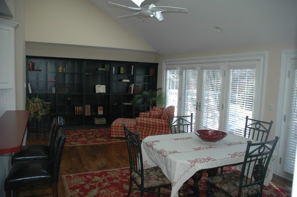 2138 Stirrup Lane Wheaton, IL 60189 - Photo 3 of 16 a view of a dining room with furniture large windows and wooden floor