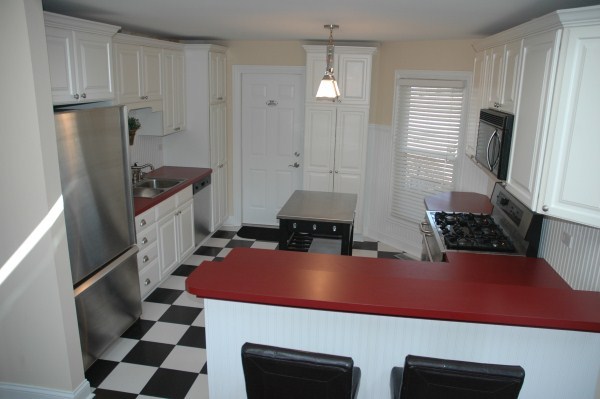 2138 Stirrup Lane Wheaton, IL 60189 - Photo 6 of 16 a kitchen with stainless steel appliances kitchen island granite countertop a sink refrigerator and cabinets