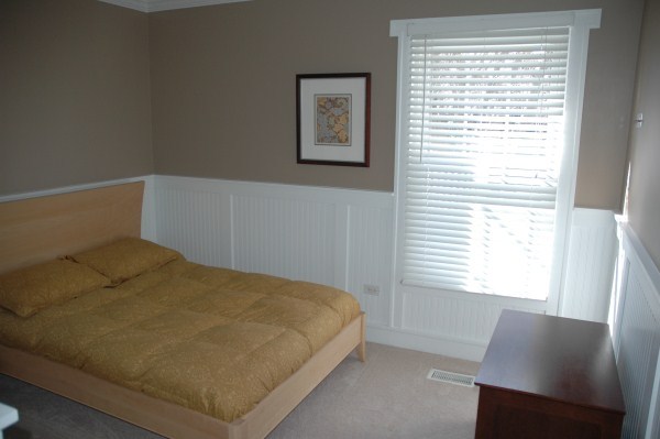 2138 Stirrup Lane Wheaton, IL 60189 - Photo 10 of 16 a bed sitting in a bedroom next to a window