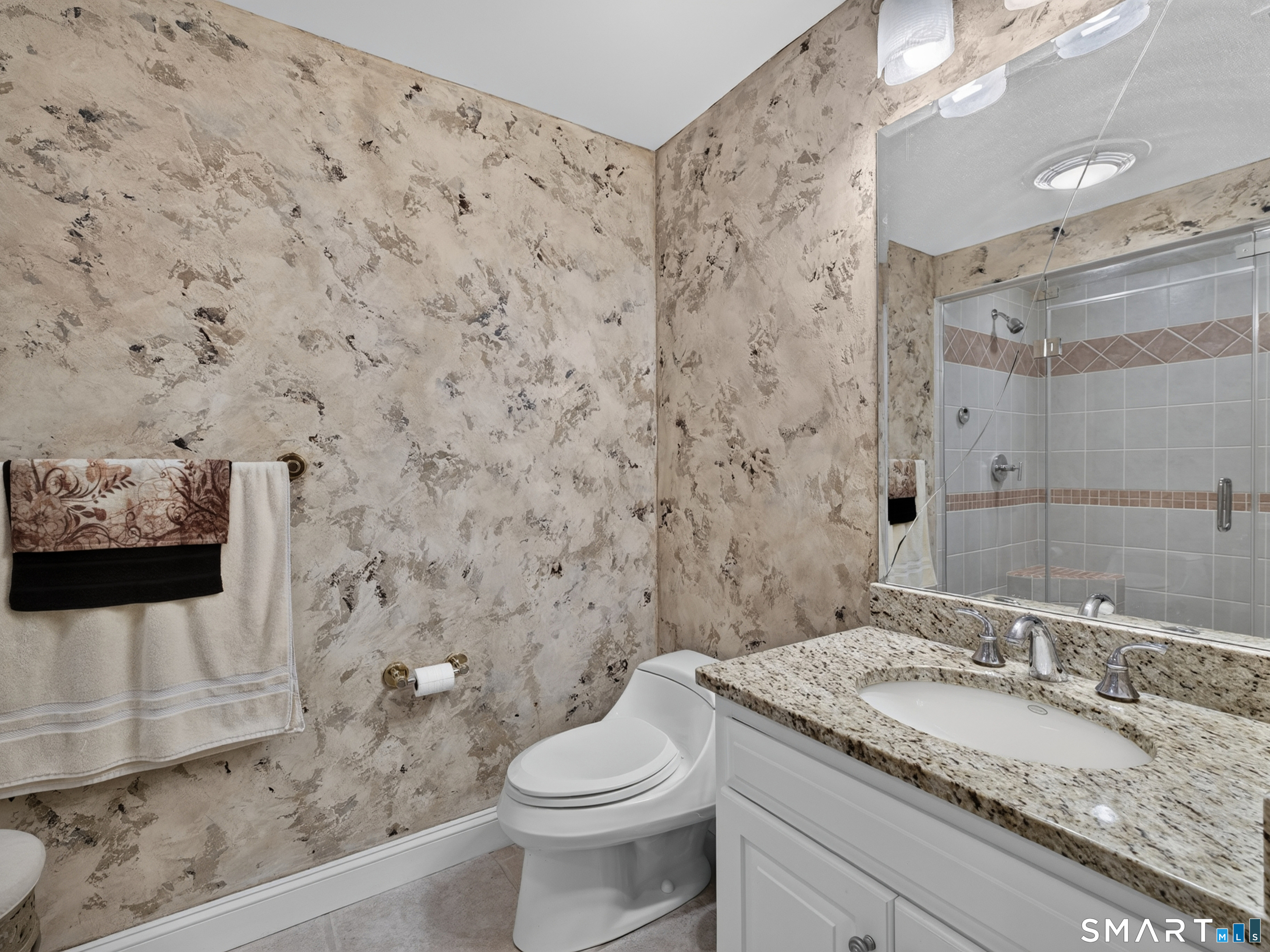 55 Hunters Ridge Rocky Hill, CT 06067 - Photo 27 of 40 a bathroom with a granite countertop toilet sink and mirror