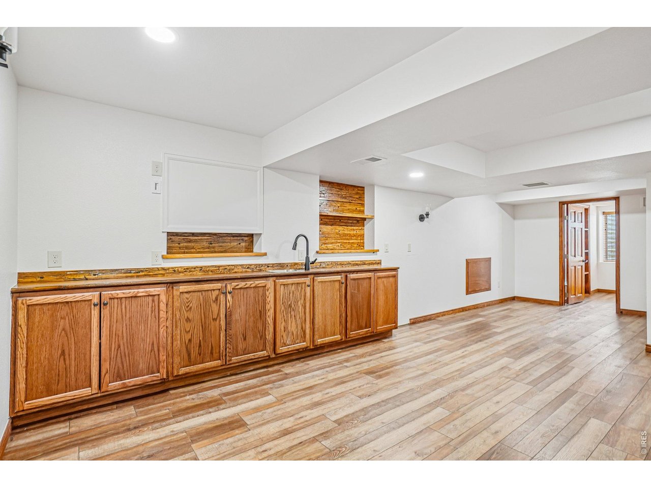 9743 Yellowstone Road Longmont, CO 80504 - Photo 37 of 50 Large wet bar in the rec room in the basement