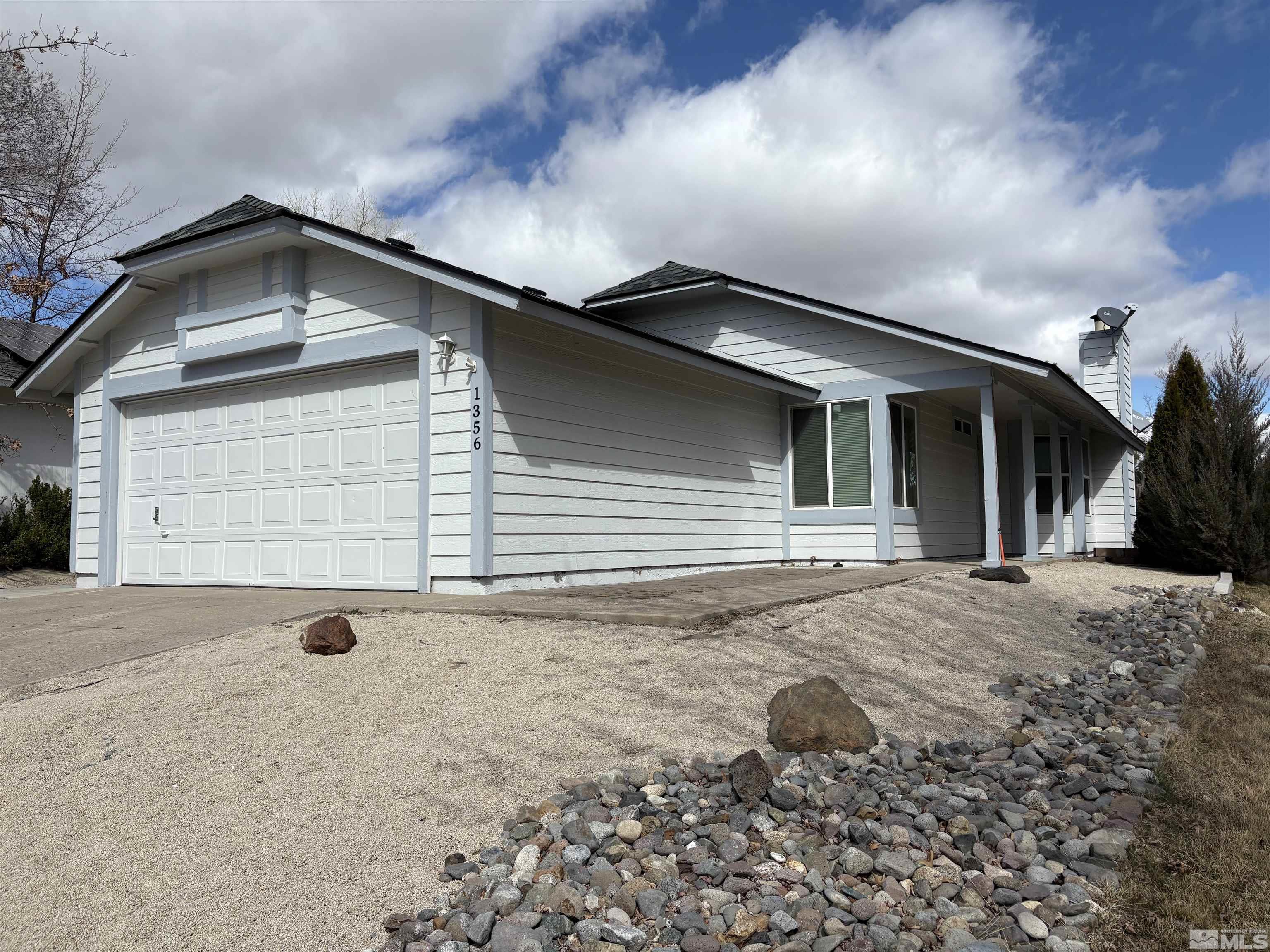 a front view of a house with backyard