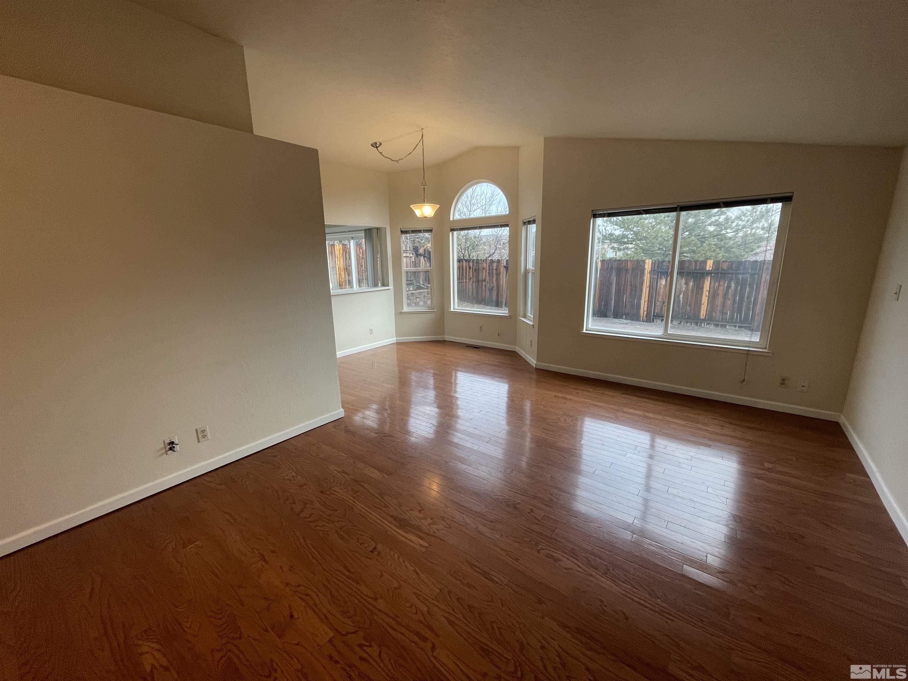 1356 Canyon Creek Road Reno, NV 89523 - Photo 3 of 16 an empty room with wooden floor and windows