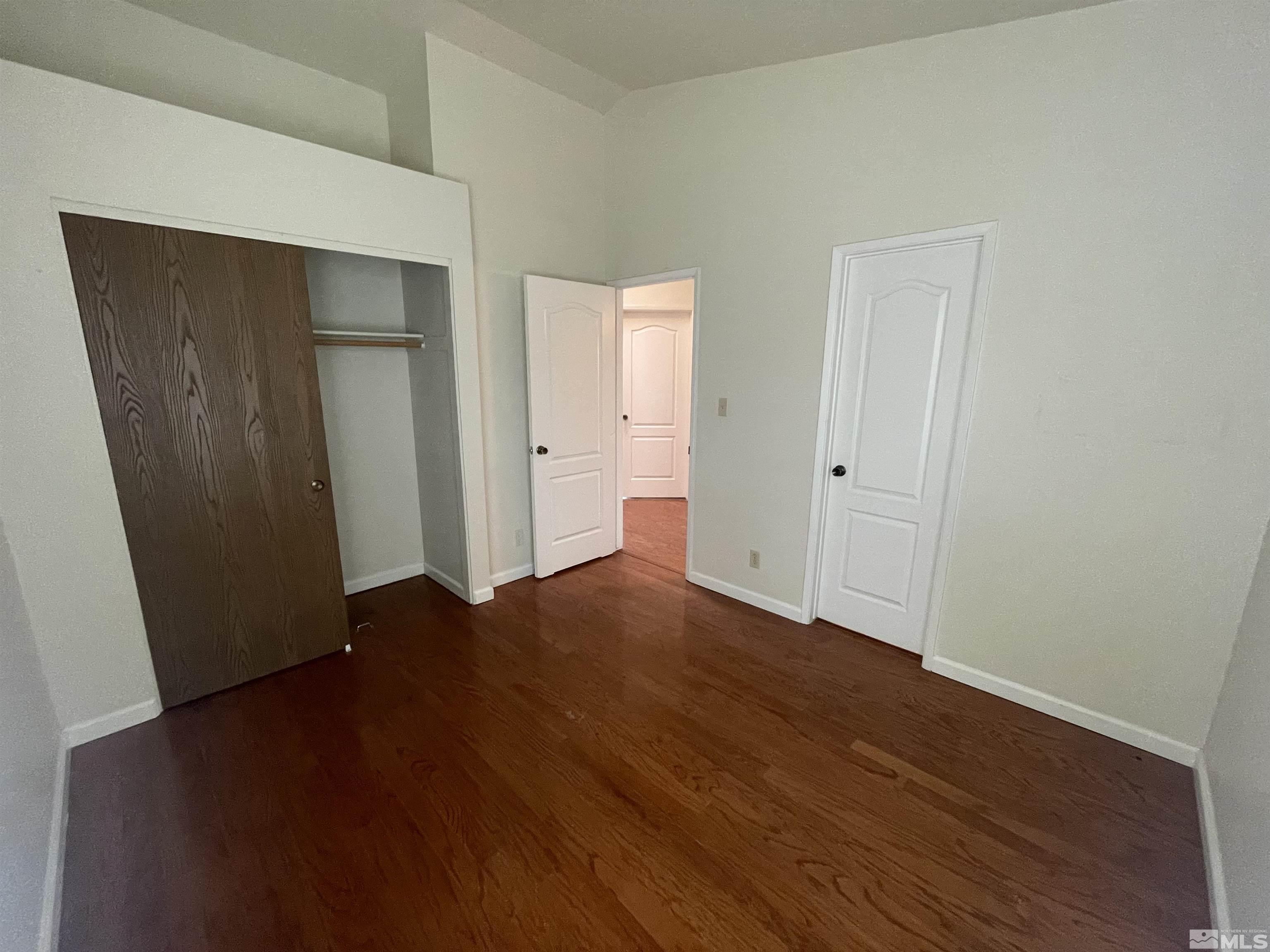 1356 Canyon Creek Road Reno, NV 89523 - Photo 8 of 16 a view of empty room with wooden floor and closet